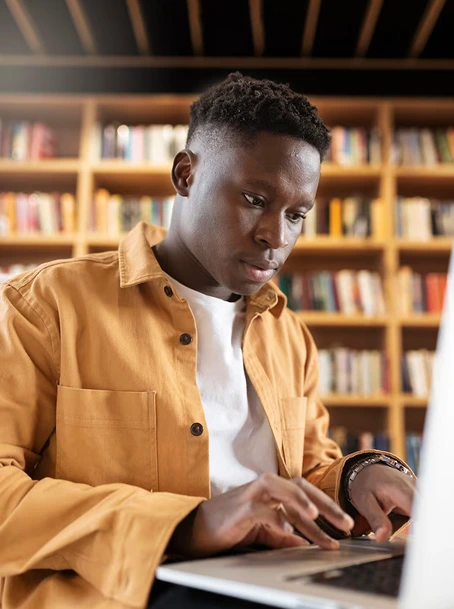 Black guy pressing laptop